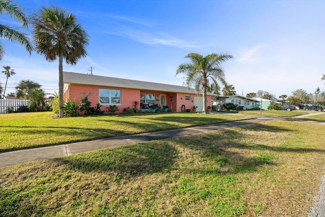 ranch-style house featuring a front yard