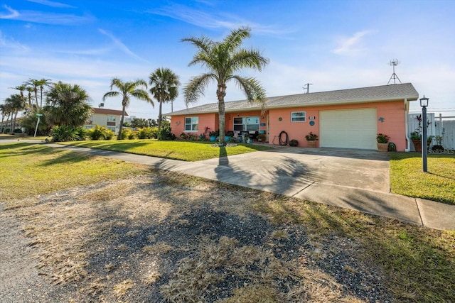 single story home with a garage and a front yard