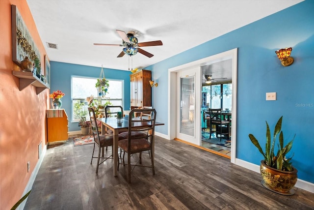 dining area with ceiling fan and dark hardwood / wood-style floors