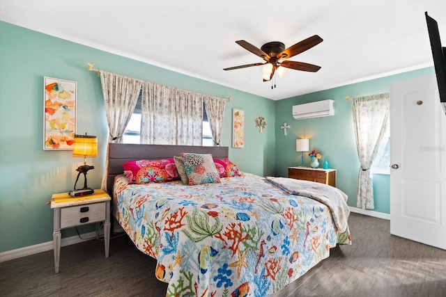 bedroom with multiple windows, dark wood-type flooring, a wall unit AC, and ceiling fan