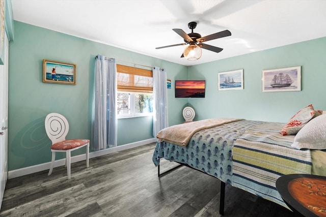 bedroom featuring dark wood-type flooring and ceiling fan