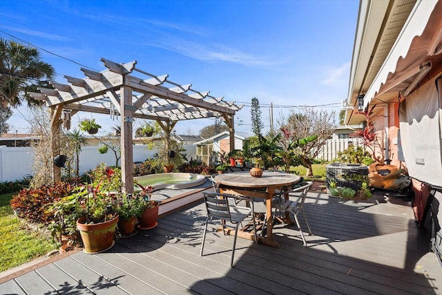 wooden terrace featuring a jacuzzi and a pergola