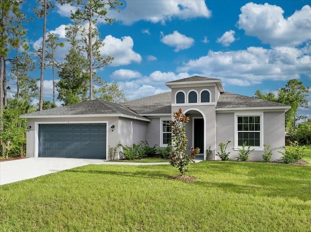 view of front of house featuring a garage and a front lawn