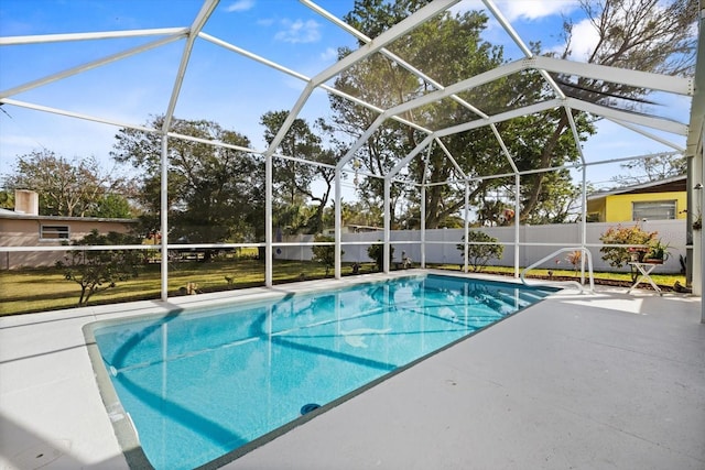 view of swimming pool with a lanai and a patio area