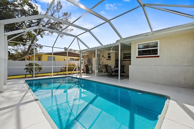 view of swimming pool with a lanai and a patio area