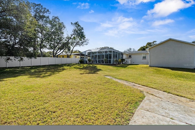 view of yard featuring a lanai