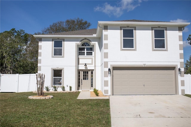 view of front of home featuring a garage and a front lawn