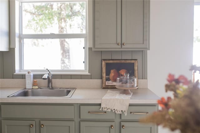 kitchen with sink and a fireplace