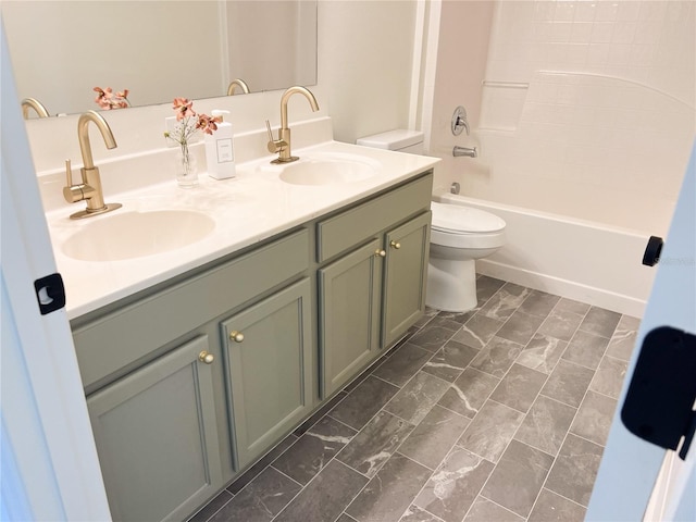 full bathroom featuring vanity, tub / shower combination, and toilet