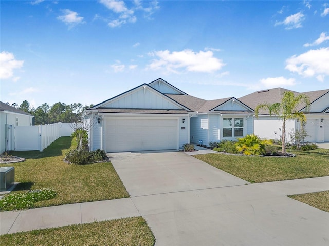 ranch-style house with a garage and a front lawn