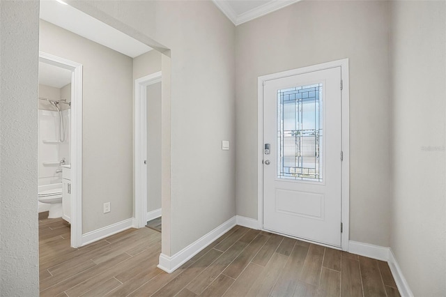 foyer entrance featuring ornamental molding