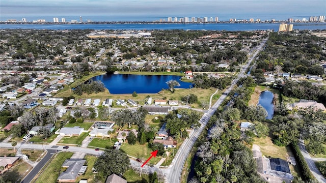 birds eye view of property with a water view