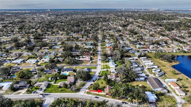 drone / aerial view featuring a residential view and a water view