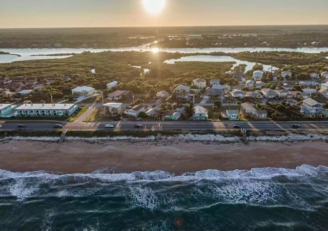 aerial view at dusk with a water view