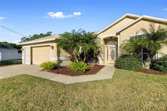 view of front of property with a garage and a front yard