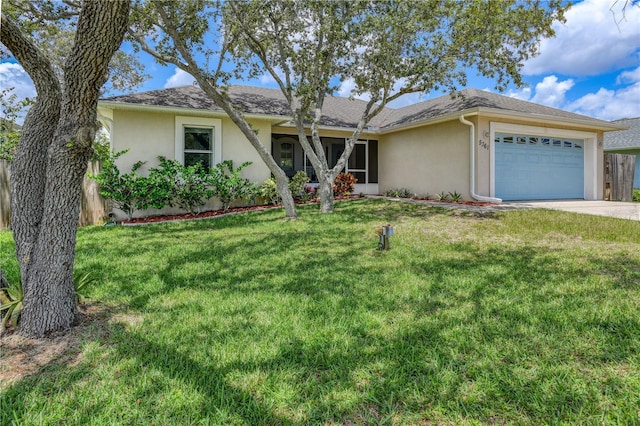 single story home featuring a garage and a front lawn