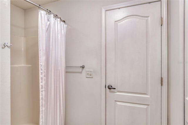 bathroom with a shower with shower curtain