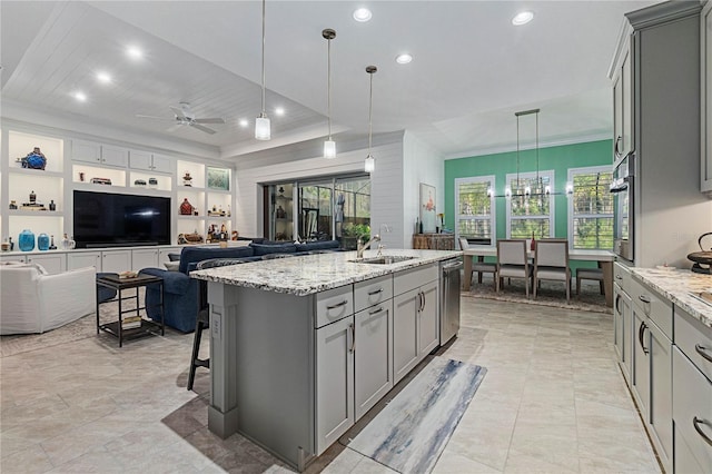 kitchen featuring a sink, gray cabinetry, and crown molding