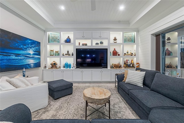 living area with built in features, wood ceiling, a tray ceiling, and ornamental molding