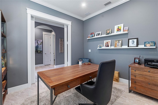 office space featuring baseboards, arched walkways, visible vents, and ornamental molding