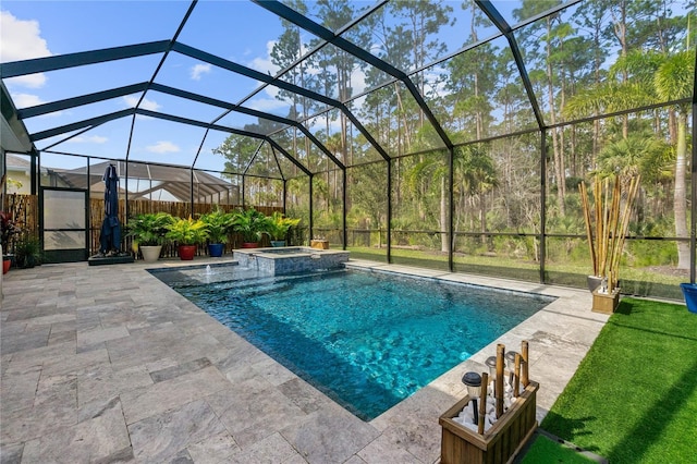 view of pool with a patio, a pool with connected hot tub, and a lanai