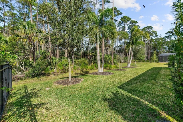 view of yard featuring glass enclosure