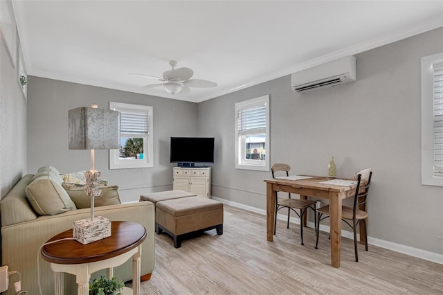 living room with crown molding, ceiling fan, a wall mounted air conditioner, and light hardwood / wood-style floors