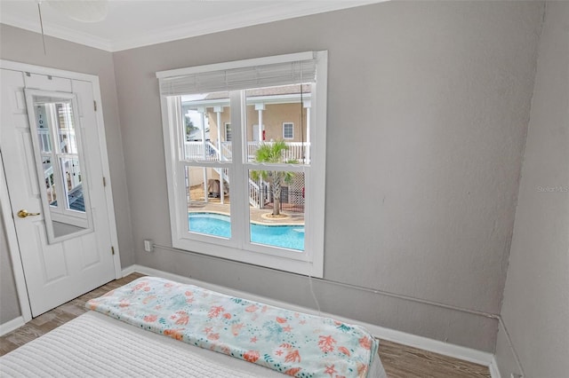 interior space with crown molding and hardwood / wood-style flooring