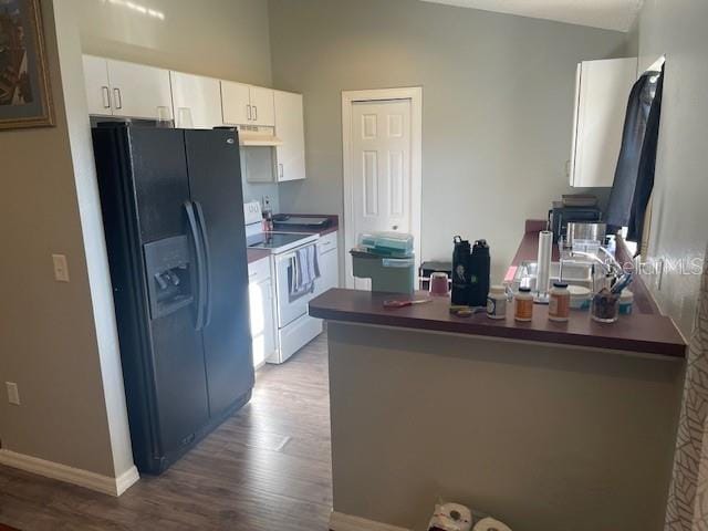 kitchen with white range with electric cooktop, hardwood / wood-style floors, ventilation hood, white cabinets, and black refrigerator with ice dispenser