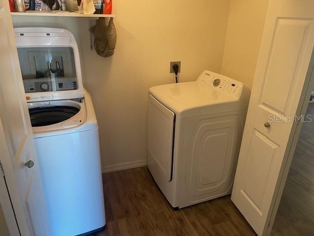 laundry area featuring dark wood-type flooring and washer and dryer