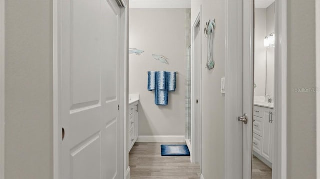 bathroom featuring vanity and wood-type flooring