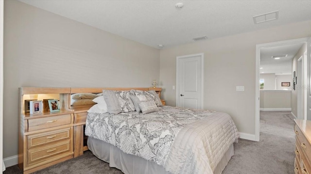 bedroom featuring light carpet