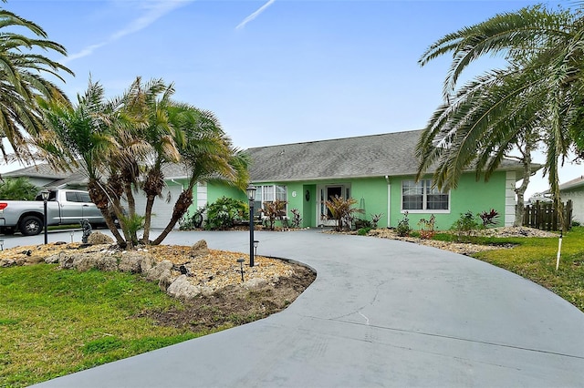 ranch-style house with a front lawn