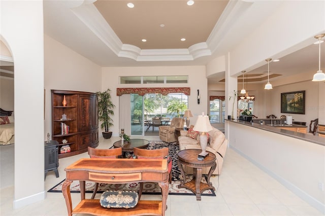 interior space with crown molding and a raised ceiling