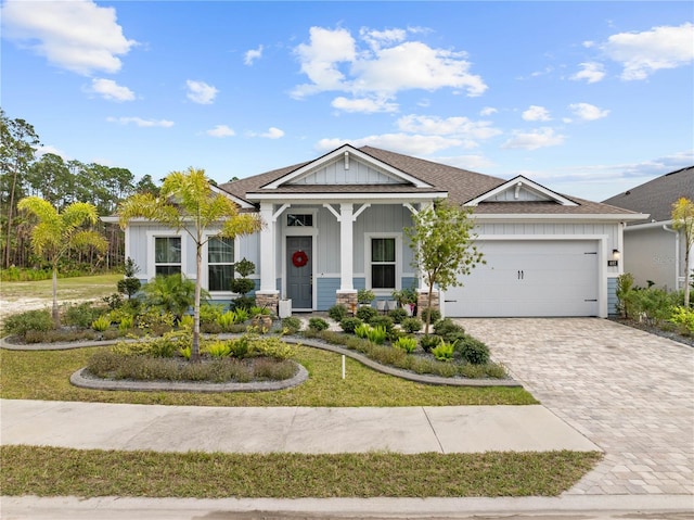 view of front of property featuring a garage and a front yard