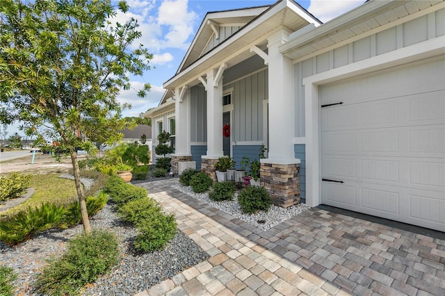 doorway to property featuring a garage