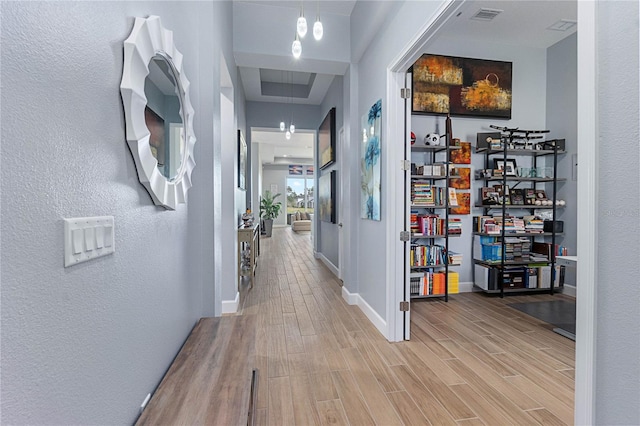 corridor with wood-type flooring