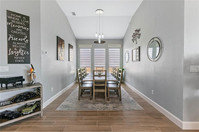 dining area featuring lofted ceiling