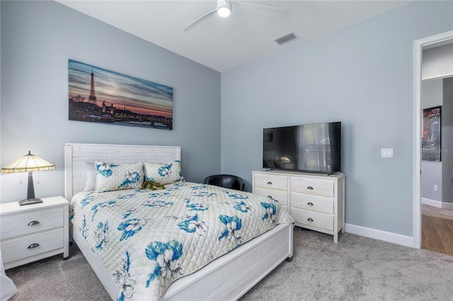 bedroom with light carpet and ceiling fan