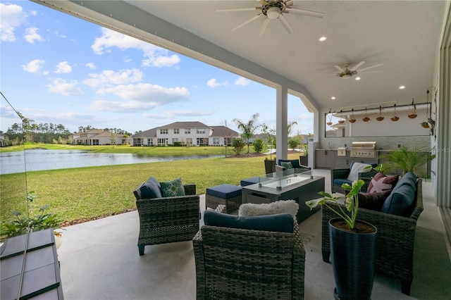 view of patio / terrace with a grill, area for grilling, ceiling fan, an outdoor living space, and a water view