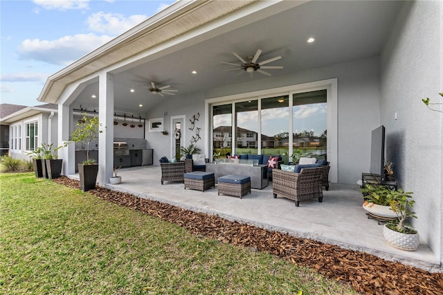 view of patio with exterior kitchen, an outdoor hangout area, and ceiling fan