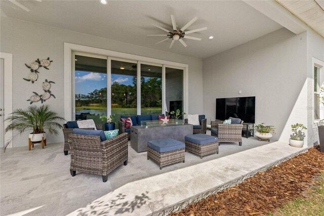 view of patio / terrace featuring ceiling fan and an outdoor living space