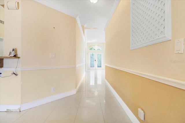 hall featuring crown molding and tile patterned floors