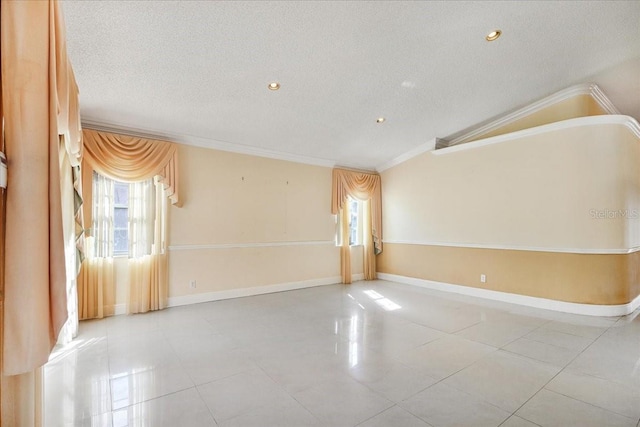 unfurnished room with crown molding, light tile patterned flooring, vaulted ceiling, and a textured ceiling