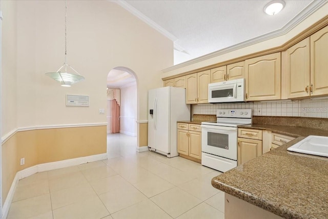 kitchen with crown molding, white appliances, tasteful backsplash, and light brown cabinets