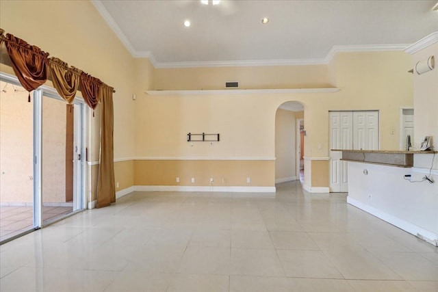 tiled empty room with crown molding