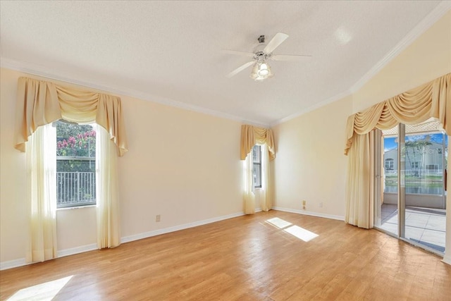 empty room featuring crown molding, ceiling fan, light hardwood / wood-style flooring, and a textured ceiling