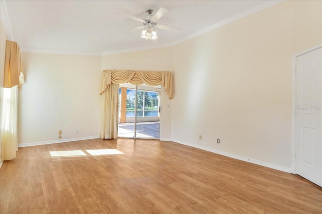 unfurnished room with ornamental molding, ceiling fan, and light wood-type flooring