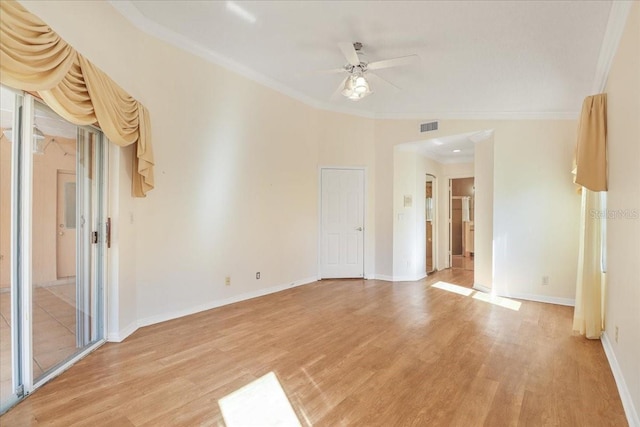 unfurnished room featuring crown molding, ceiling fan, and light wood-type flooring