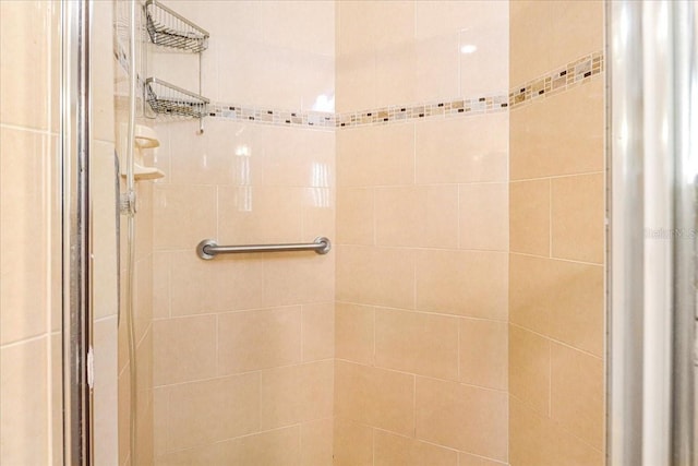 bathroom with tiled shower